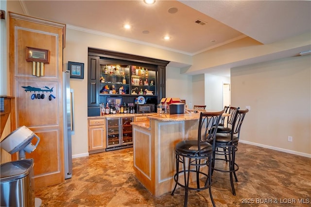 55 Shagbark Dr, Sunrise Beach, MO 65079 - indoor dry bar with wine cooler, ornamental molding, baseboards, freestanding refrigerator, and recessed lighting