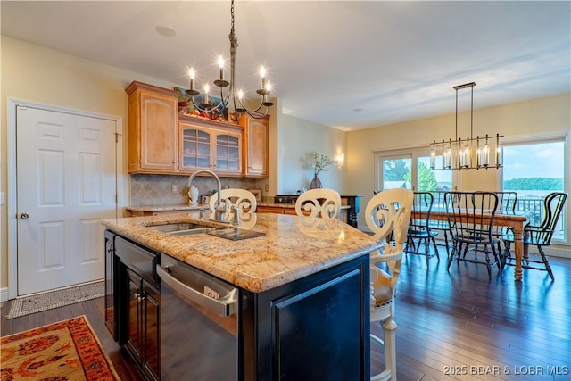 55 Shagbark Dr, Sunrise Beach, MO 65079 - kitchen featuring a chandelier, dishwasher, a sink, and dark wood-style flooring