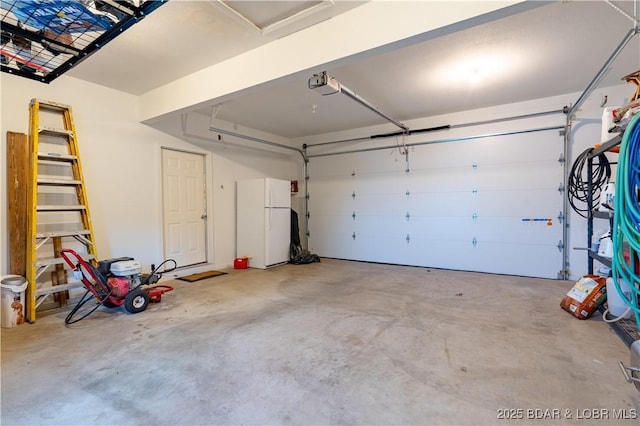 55 Shagbark Dr, Sunrise Beach, MO 65079 - garage with freestanding refrigerator and a garage door opener