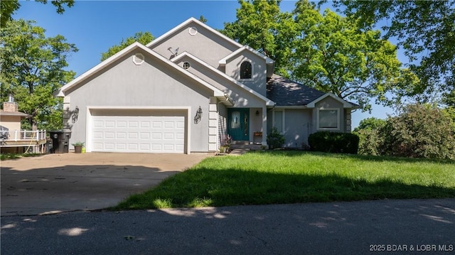 1396 Robyn Ct, Osage Beach, MO 65065 - view of front facade featuring an attached garage, driveway, stucco siding, and a front yard