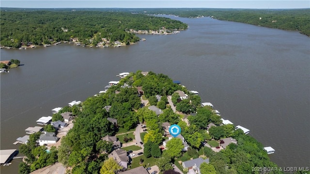 1396 Robyn Ct, Osage Beach, MO 65065 - aerial perspective of suburban area featuring a forest and a large body of water