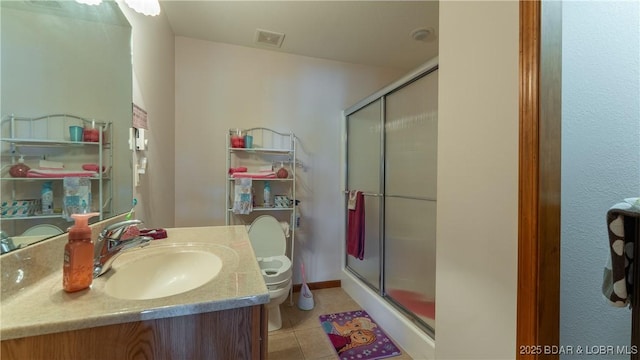 1396 Robyn Ct, Osage Beach, MO 65065 - full bathroom with toilet, a shower stall, vanity, and tile patterned floors