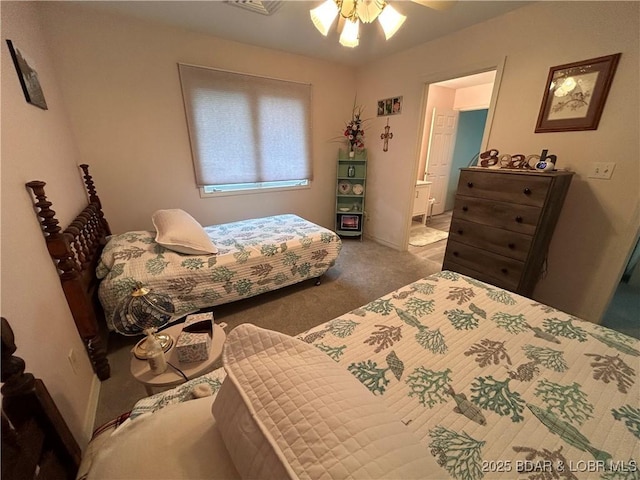 1396 Robyn Ct, Osage Beach, MO 65065 - bedroom featuring carpet floors, connected bathroom, and ceiling fan