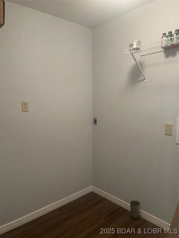 34443 Ivy Bend Rd, Stover, MO 65078 - laundry room with dark wood-style floors and baseboards