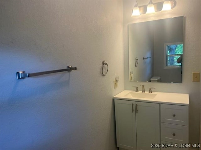 34443 Ivy Bend Rd, Stover, MO 65078 - bathroom with vanity and a textured wall