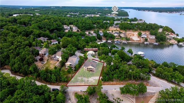 980 Eagle Dr, Lake Ozark, MO 65049 - aerial perspective of suburban area featuring a large body of water and property parcel outlined