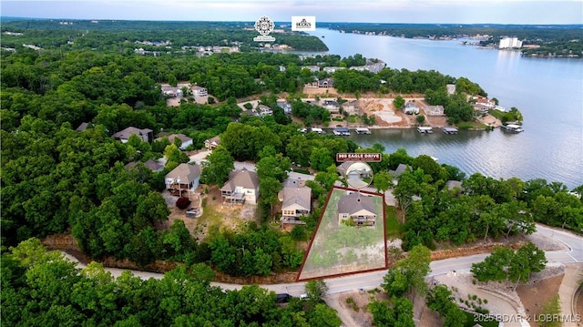 980 Eagle Dr, Lake Ozark, MO 65049 - aerial perspective of suburban area with a large body of water and property parcel outlined