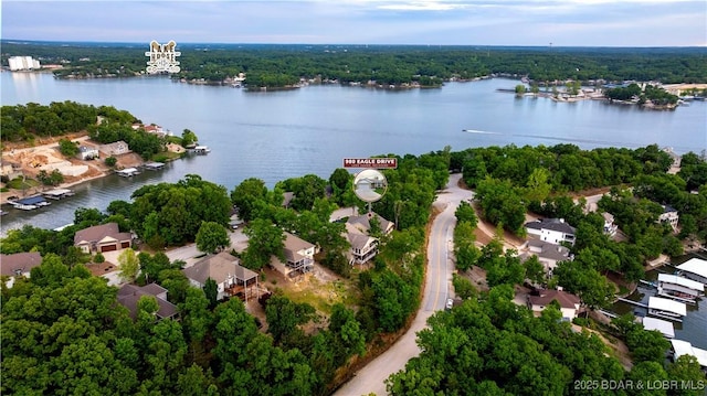 980 Eagle Dr, Lake Ozark, MO 65049 - aerial view of residential area with a nearby body of water and a heavily wooded area