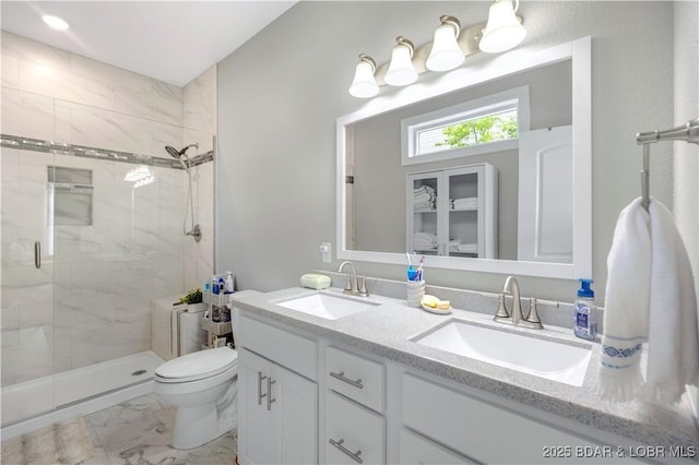 980 Eagle Dr, Lake Ozark, MO 65049 - full bathroom with marble finish floors, a stall shower, double vanity, and toilet
