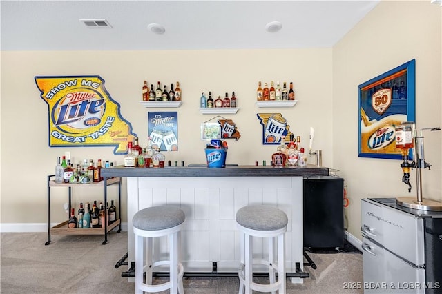 980 Eagle Dr, Lake Ozark, MO 65049 - indoor wet bar featuring carpet flooring and baseboards