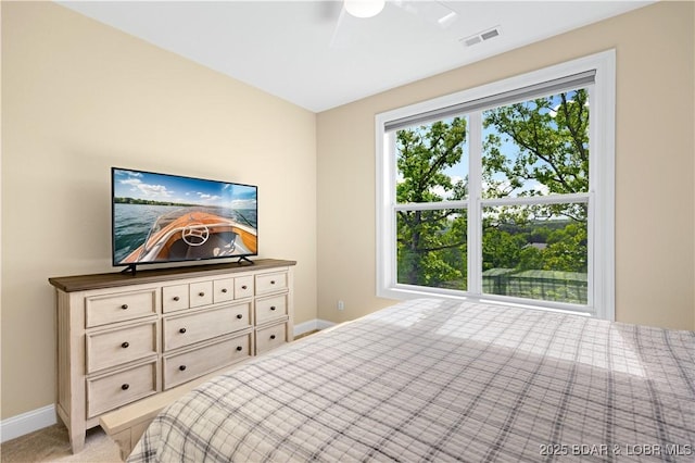 980 Eagle Dr, Lake Ozark, MO 65049 - bedroom with baseboards, light carpet, and a ceiling fan
