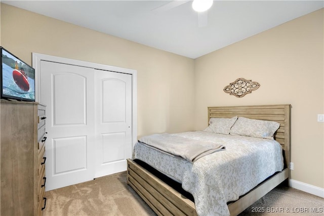 980 Eagle Dr, Lake Ozark, MO 65049 - bedroom with light carpet, ceiling fan, baseboards, and a closet
