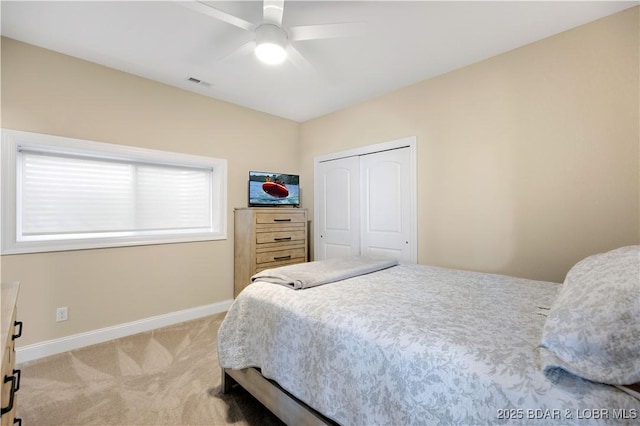 980 Eagle Dr, Lake Ozark, MO 65049 - bedroom with carpet, baseboards, a closet, and a ceiling fan