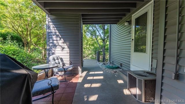312 Windsor Bay Dr Unit 2A, Camdenton, MO 65020 - view of patio featuring central AC and a grill