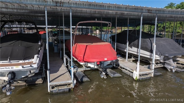 312 Windsor Bay Dr Unit 2A, Camdenton, MO 65020 - dock area with boat lift and a water view