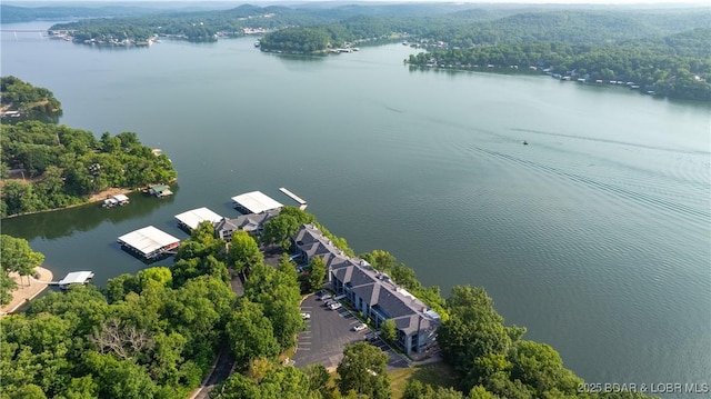 312 Windsor Bay Dr Unit 2A, Camdenton, MO 65020 - drone / aerial view of a nearby body of water and a heavily wooded area