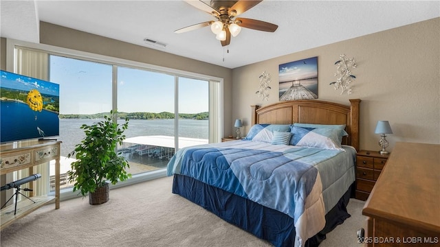 312 Windsor Bay Dr Unit 2A, Camdenton, MO 65020 - carpeted bedroom with access to outside and ceiling fan
