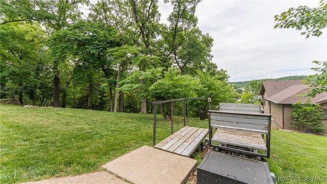 288 Oak Ridge Rd, Lake Ozark, MO 65049 - view of grassy yard featuring a deck