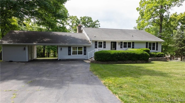 288 Oak Ridge Rd, Lake Ozark, MO 65049 - view of front facade with asphalt driveway, a chimney, a front yard, and an attached carport