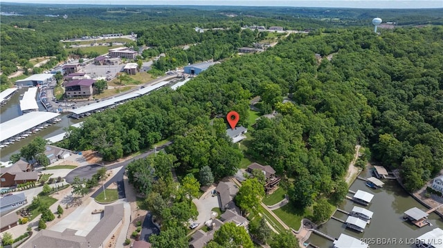 288 Oak Ridge Rd, Lake Ozark, MO 65049 - aerial view of property and surrounding area with a heavily wooded area