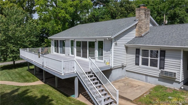288 Oak Ridge Rd, Lake Ozark, MO 65049 - rear view of property featuring roof with shingles, a chimney, a yard, a wooden deck, and stairway