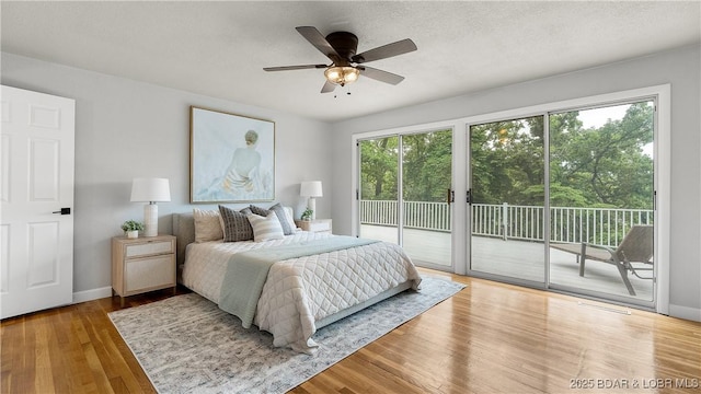 288 Oak Ridge Rd, Lake Ozark, MO 65049 - bedroom featuring access to exterior, wood finished floors, and ceiling fan