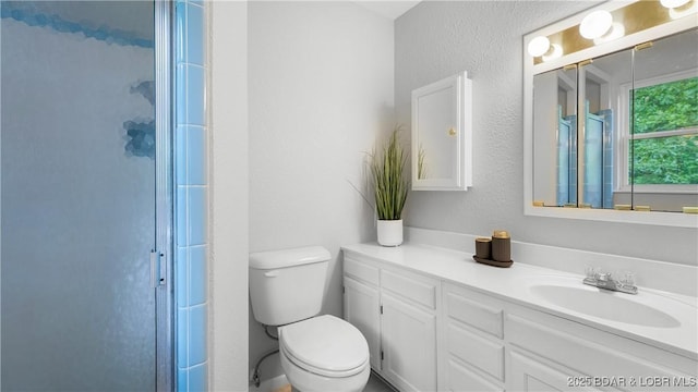 288 Oak Ridge Rd, Lake Ozark, MO 65049 - full bathroom with a shower stall, vanity, and toilet