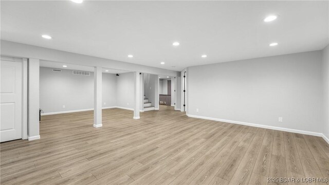 288 Oak Ridge Rd, Lake Ozark, MO 65049 - finished basement with stairs, light wood-style floors, and recessed lighting