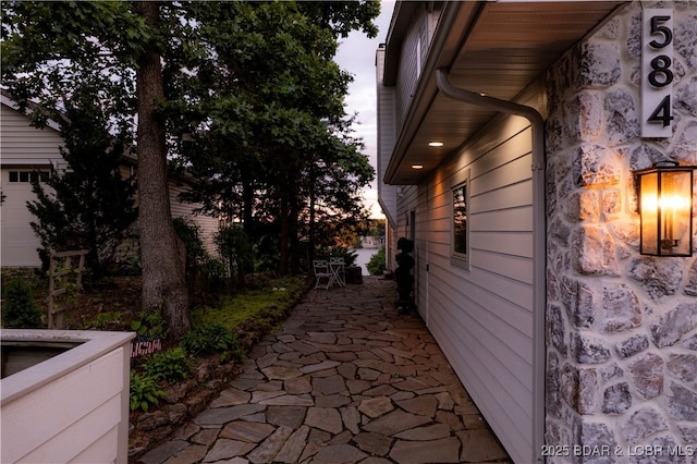 584 Black Hawk Dr, Lake Ozark, MO 65049 - view of side of property featuring a patio