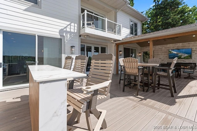 584 Black Hawk Dr, Lake Ozark, MO 65049 - wooden terrace with outdoor dining area