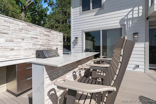 584 Black Hawk Dr, Lake Ozark, MO 65049 - wooden deck featuring an outdoor bar