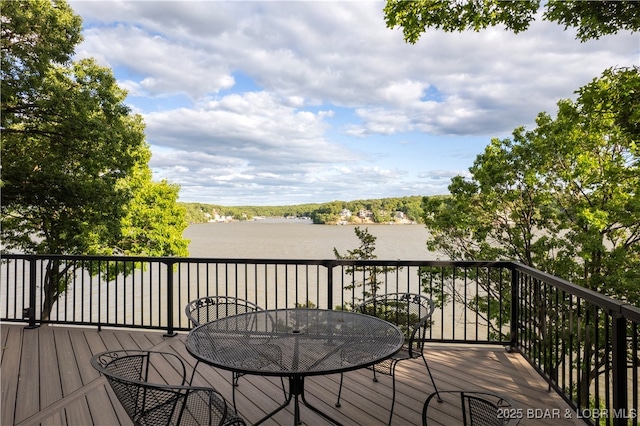 584 Black Hawk Dr, Lake Ozark, MO 65049 - wooden deck featuring outdoor dining area