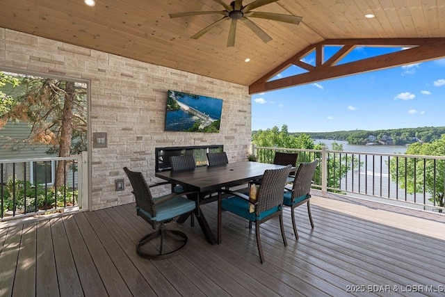 584 Black Hawk Dr, Lake Ozark, MO 65049 - wooden deck with a ceiling fan, outdoor dining area, and a water view