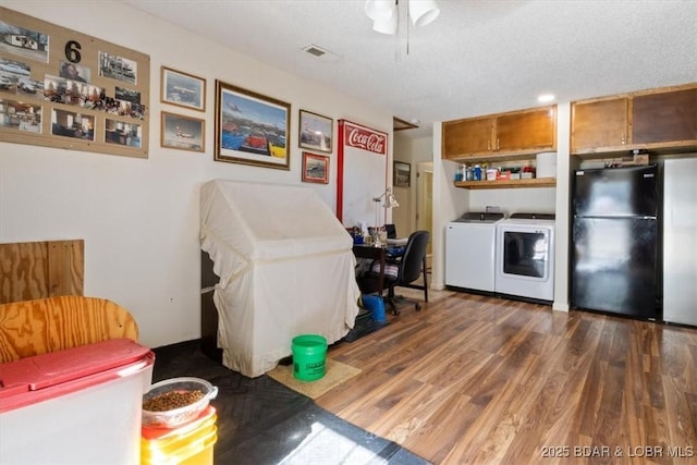 169 Kaanapali Dr, Roach, MO 65787 - kitchen featuring freestanding refrigerator, independent washer and dryer, dark wood-style floors, open shelves, and brown cabinets
