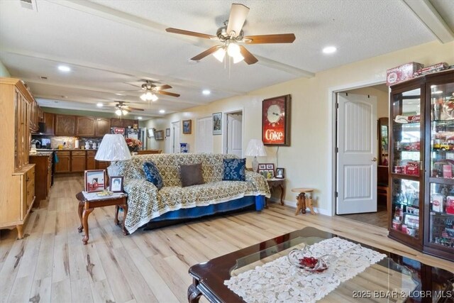 169 Kaanapali Dr, Roach, MO 65787 - living room featuring ceiling fan, light wood-style floors, baseboards, and recessed lighting