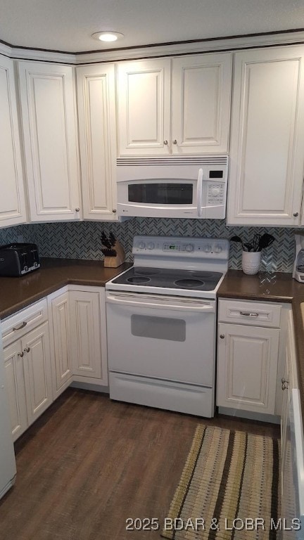 1481 Ledges Dr Unit 221, Osage Beach, MO 65065 - kitchen featuring white appliances, white cabinetry, dark countertops, decorative backsplash, and dark wood-style flooring