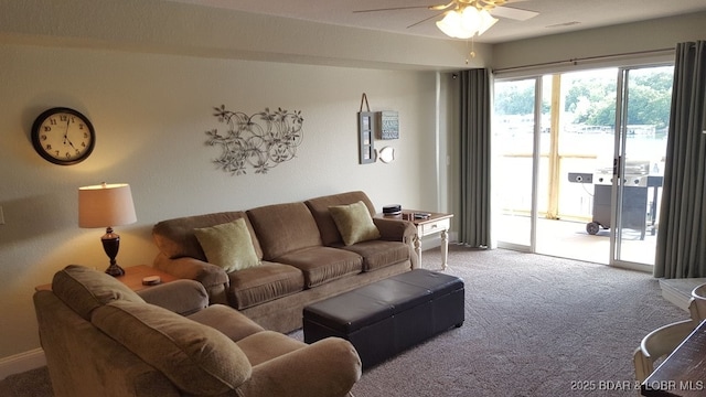 1481 Ledges Dr Unit 221, Osage Beach, MO 65065 - living area with light colored carpet, a ceiling fan, and baseboards