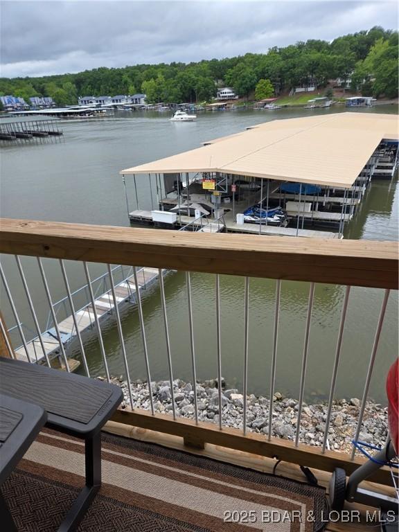 1481 Ledges Dr Unit 221, Osage Beach, MO 65065 - balcony featuring a water view and a dock