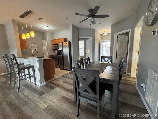 275 Flynn Rd Unit 207, Lake Ozark, MO 65049 - dining room with dark wood-style floors and a ceiling fan