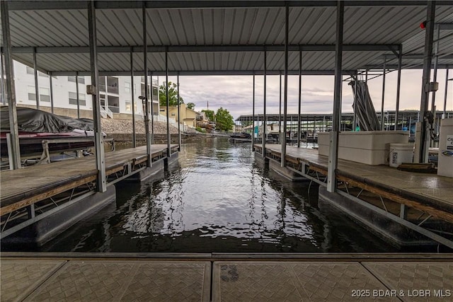 275 Flynn Rd Unit 207, Lake Ozark, MO 65049 - dock featuring a water view and boat lift