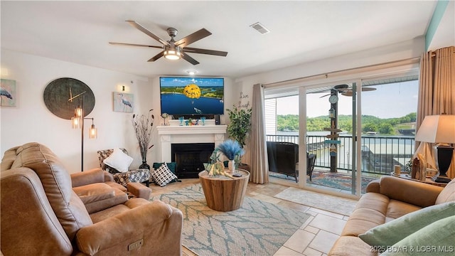 364 Cedar Heights Dr Unit 2D, Camdenton, MO 65020 - living room featuring ceiling fan and a fireplace