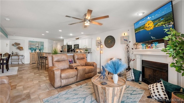 364 Cedar Heights Dr Unit 2D, Camdenton, MO 65020 - living area with a ceiling fan, a fireplace, stone finish floors, and recessed lighting