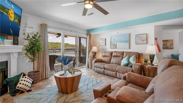 364 Cedar Heights Dr Unit 2D, Camdenton, MO 65020 - living area with a ceiling fan and a fireplace