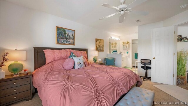 364 Cedar Heights Dr Unit 2D, Camdenton, MO 65020 - carpeted bedroom with ensuite bath and a ceiling fan