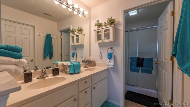 364 Cedar Heights Dr Unit 2D, Camdenton, MO 65020 - bathroom with double vanity and a stall shower