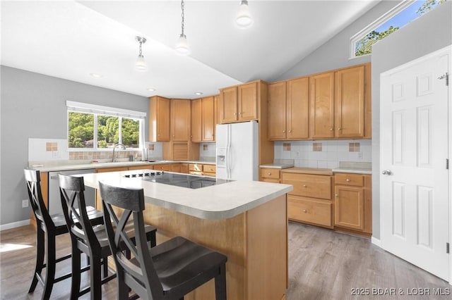 25 Redwood Ct, Sunrise Beach, MO 65079 - kitchen with white fridge with ice dispenser, black electric cooktop, backsplash, light wood-style floors, and lofted ceiling
