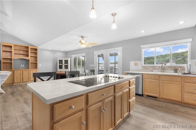 25 Redwood Ct, Sunrise Beach, MO 65079 - kitchen featuring stainless steel dishwasher, black electric cooktop, french doors, light wood finished floors, and light countertops