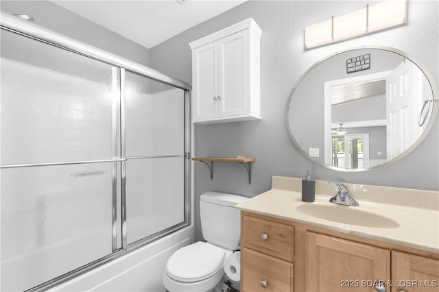 25 Redwood Ct, Sunrise Beach, MO 65079 - full bath featuring toilet, vanity, bath / shower combo with glass door, and ceiling fan