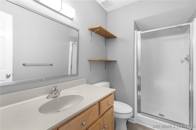 25 Redwood Ct, Sunrise Beach, MO 65079 - bathroom featuring toilet, a shower stall, vanity, and wood finished floors