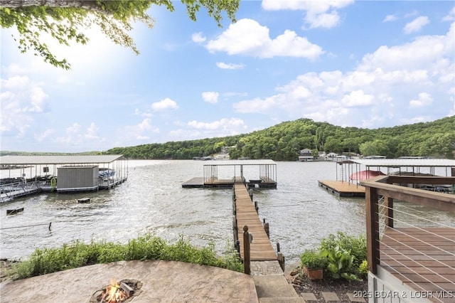 25 Redwood Ct, Sunrise Beach, MO 65079 - dock area featuring a water view, a forest view, and a fire pit